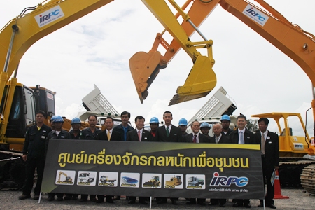 Officials gather around the new equipment.